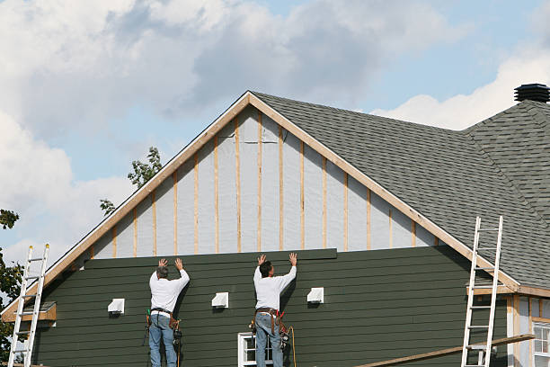 Professional Emergency Siding Repair technician working in Union City, IN